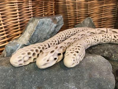 Three Articulating Topology Snakes