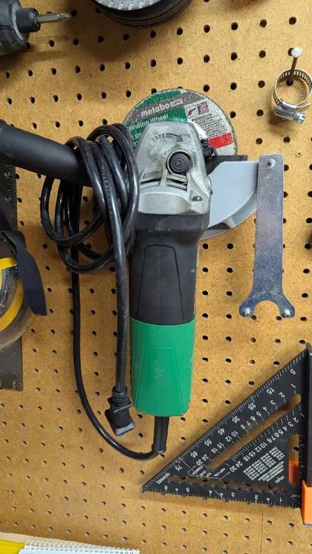 Pegboard holder for Angle Grinder and key   