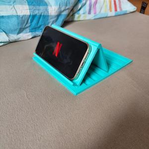 Phone stand, with a large base for the bed