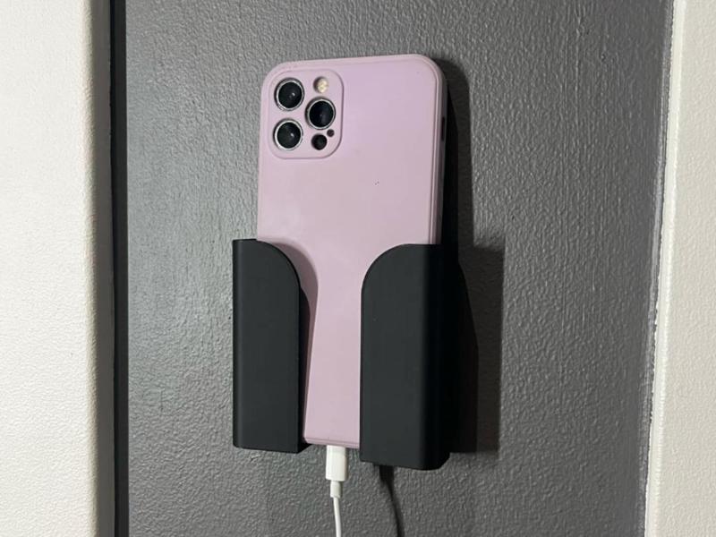 Wall mounted phone holder