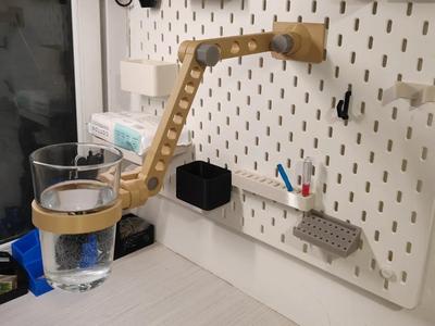 Round holes, IKEA SKADIS pegboard robotic arm, with mobile phone, GoPro sports camera mount, cup holder, iPad tablet mount