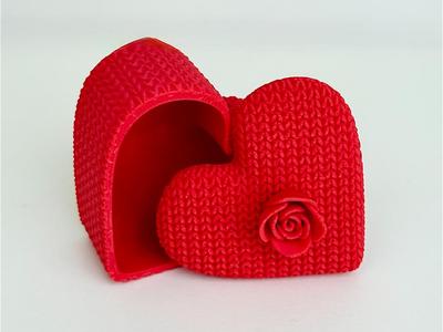 Knitted heart-shaped storage box with flower