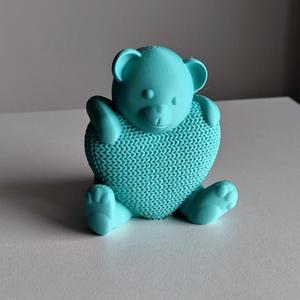 Teddy bear with knitted heart