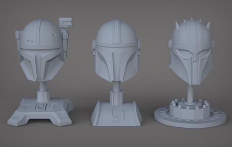 The 3 Mandalorians three star wars helmets on table