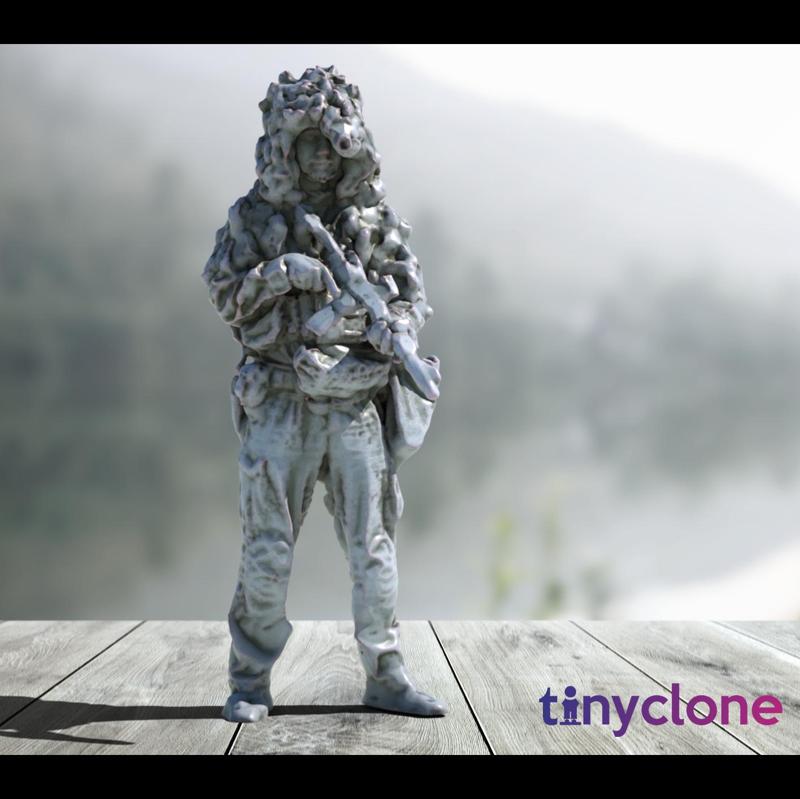 Soldier in ghillie helmet