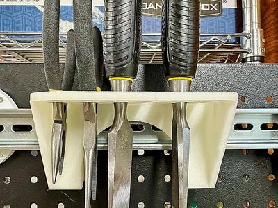 A DIN rail mounting bracket to hold chisels, pliers, scissors, and other such things