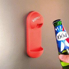 Bottle opener with cap catcher