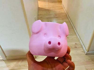 An exceptionally practical and capacious adorable pig head pen holder