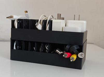 A space-saving and easy-to-categorize storage box for chargers and data cables