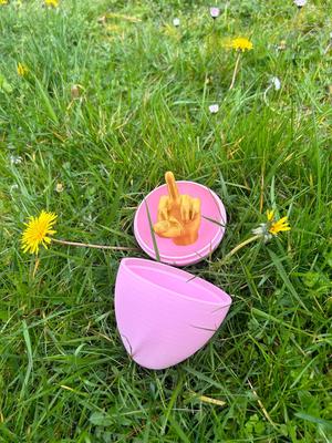 Easter egg with thread and friendly hand (L & R)