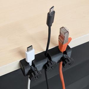 Desk cable holder with cable fixation