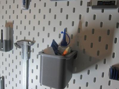 IKEA pegboard, detachable storage boxes.