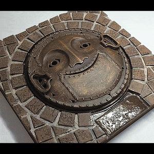 Smiling manhole cover of the Ghibli Museum