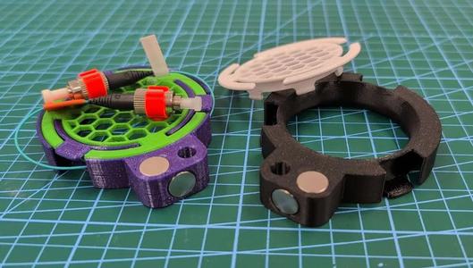 Fiber or cable spool with securing cover, M6 screw hole and magnets   