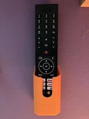 Holder for a remote control wall mount