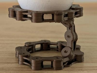 Egg cup in bicycle chain design