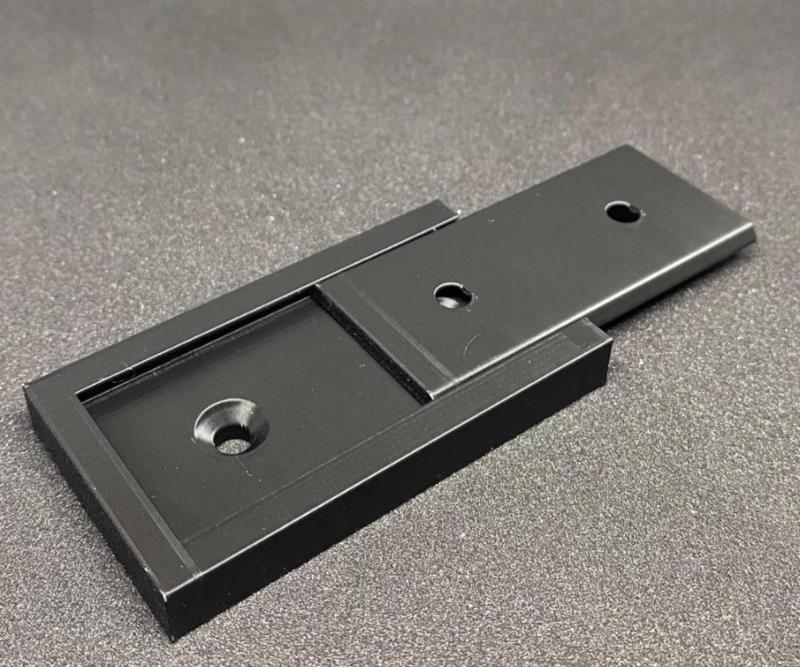 Just a universal wall mount, but only 7mm thick