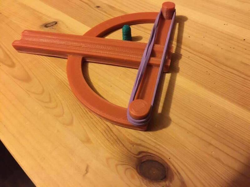 elastic powered pellet slinger