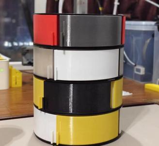 Repurposed filament spool storage drawers, spiral structure, rotatable, infinitely stackable.