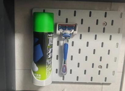 Razor and foam holder for IKEA pegboard