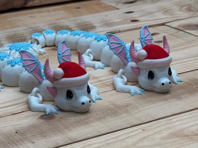 Snow Dragon wearing a Santa hat