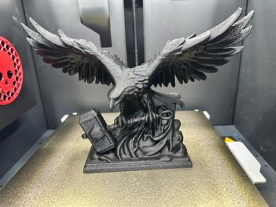 Eagle grasping Thor’s hammer statue